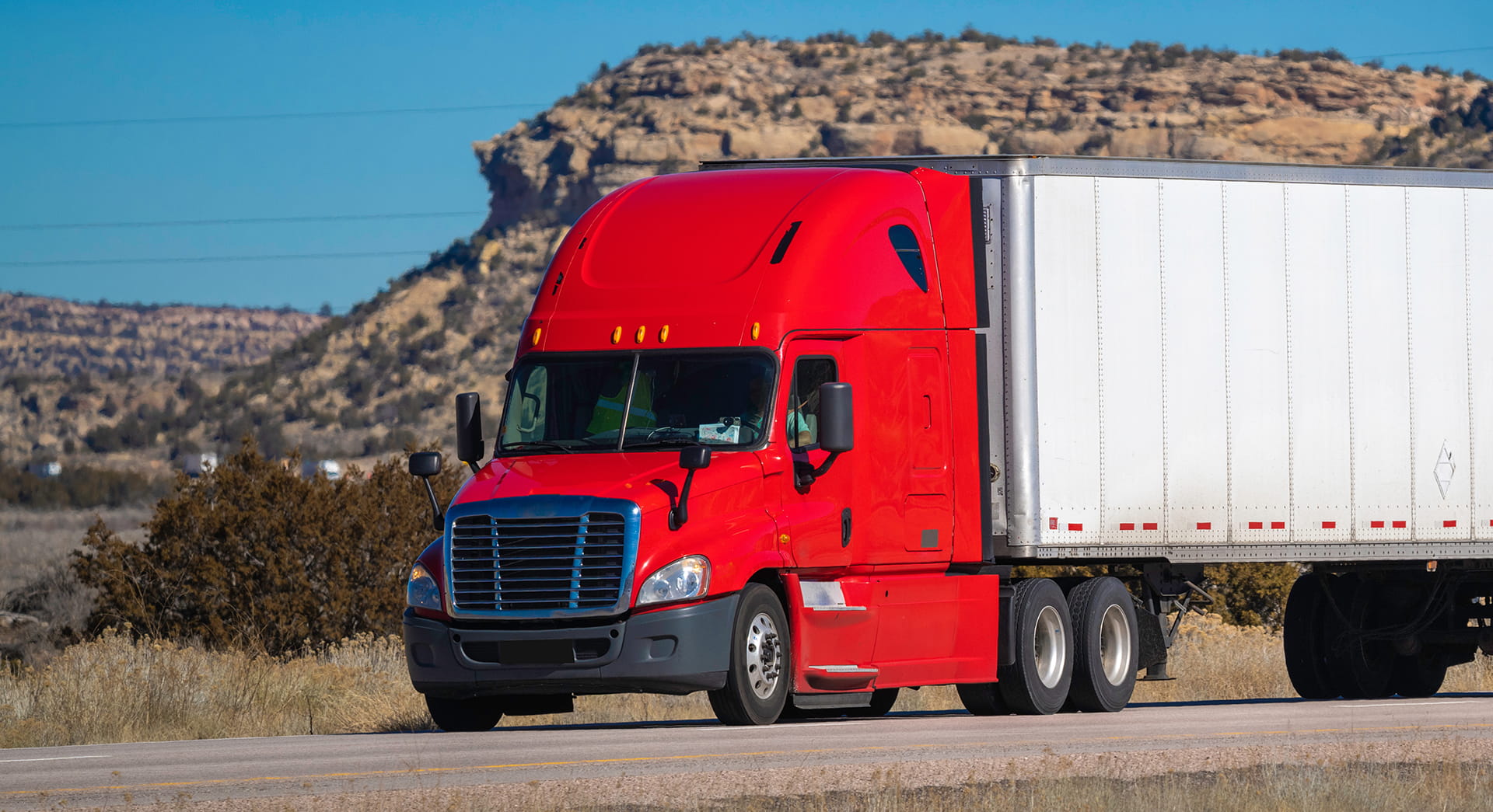 A UGL tractor moving down the highway